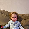 child, toddler, baby, portrait, sitting, couch, sofa, shirt, striped_shirt, anchor_pattern, red_hair, blue_eyes, face, eyes, hair, indoors, home, furniture, looking_at_camera, cute