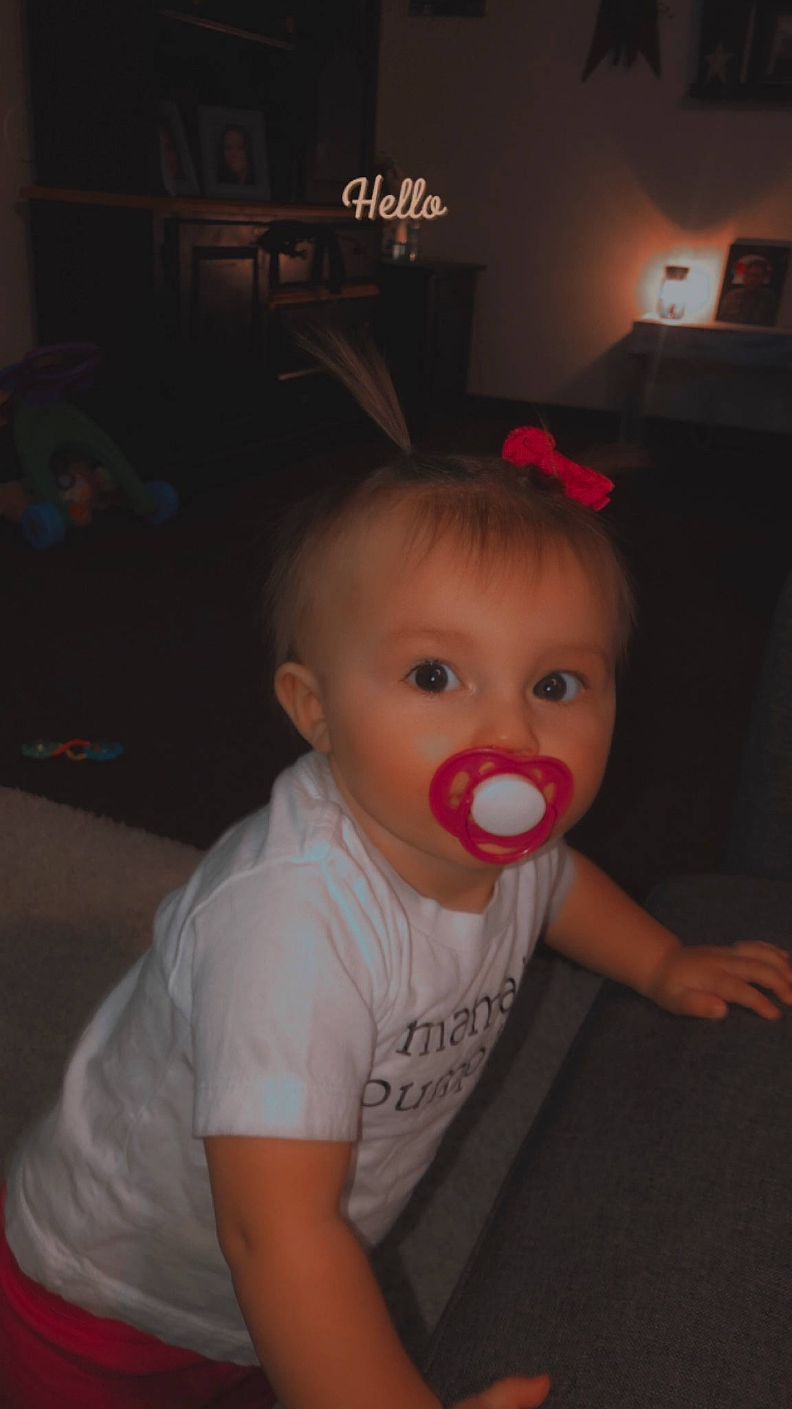 Arabella is registered to the contest to win money with this photo: baby, baby_toddler_clothing, chair, cheek, child, couch, darkness, eyelash, flash_photography, flooring, fun, iris, person, room, sitting, sleeve, t_shirt, toddler