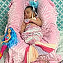 Severena is registered to the contest to win money with this photo: baby, sleeping, mermaid_costume, crochet, pink, plush, cushion, doll, toy, blue_hair, wand, patterned_background, fabric, bed, child, infant, cute, soft_texture, decor, resting
