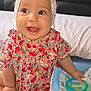 Talya a rejoint le concours — aidez-le/la à gagner de superbes lots ! baby, baby_wipes, bed, child, cute, expression, floral_dress, foot, hand, happy, headband, indoors, infant, natural_light, person, pillow, sitting, skin, smiling, toddler