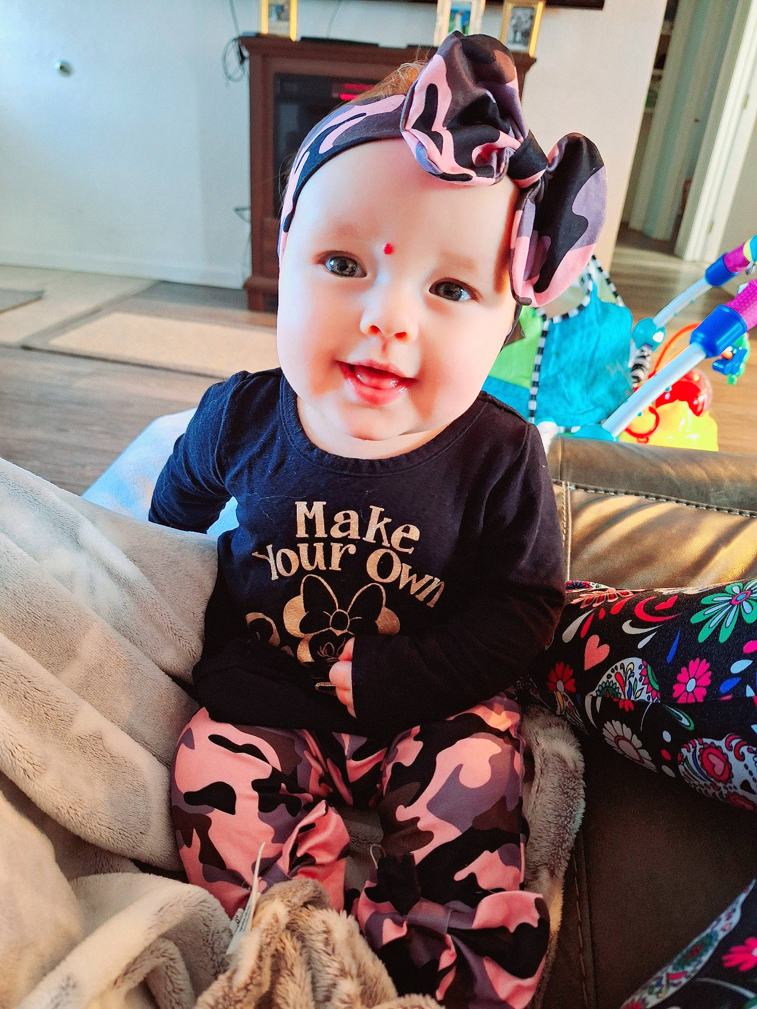 Artemiss is registered to the contest to win money with this photo: baby, baby_toddler_clothing, child, cool, costume, event, eyewear, fashion_accessory, fun, happy, head, headwear, iris, lap, pattern, person, personal_protective_equipment, pink, sitting, sleeve