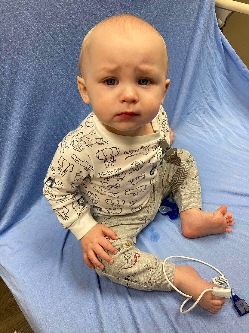 Keaton joined the competition — help win amazing prizes! baby, baby_toddler_clothing, cheek, child, comfort, eye, finger, floor, flooring, human_body, joint, mouth, neck, nose, person, sitting, skin, sleeve, t_shirt, textile