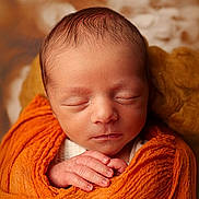 Tiago participe au concours pour gagner de l'argent avec cette photo : baby, child, closeup, cozy, cute, face, hands, head, infant, newborn, orange_blanket, peaceful, portrait, rest, skin, sleeping, soft, tiny, warm, wrapped