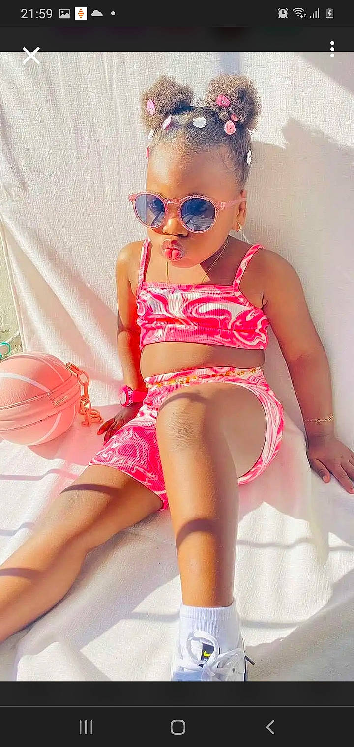 Lyliana participe au concours pour gagner de l'argent avec cette photo : baby_toddler_clothing, beauty, chest, dress, eyewear, glasses, goggles, human_body, knee, leg, magenta, one_piece_swimsuit, person, pink, shorts, sunglasses, swimwear, thigh, trunk, undergarment