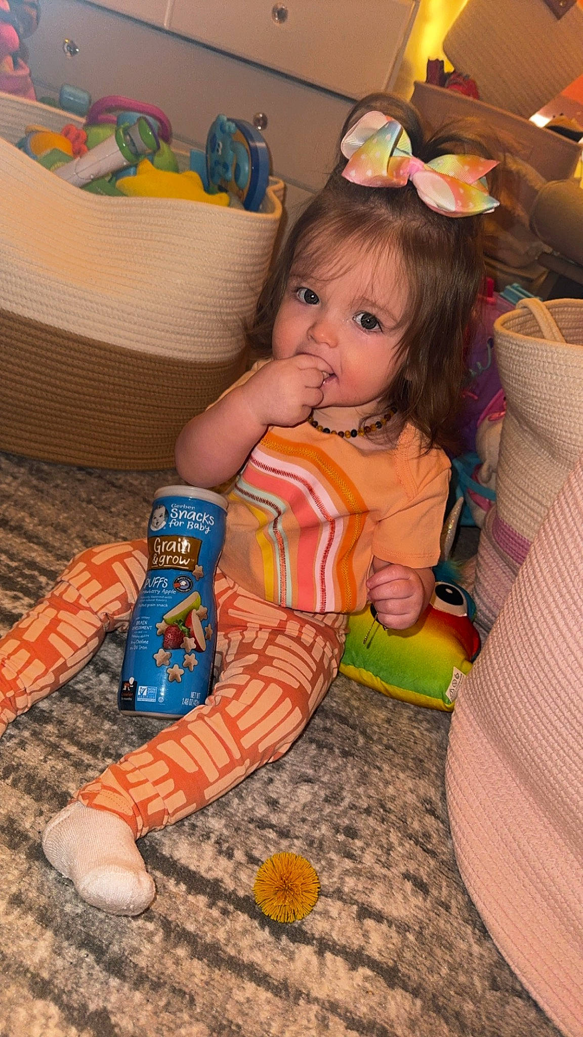 Harper joined the competition — help win amazing prizes! baby, baby_playing_with_toys, baby_toddler_clothing, baby_toys, cheek, child, comfort, flooring, foot, fun, hairstyle, happy, human_leg, iris, orange, person, room, sitting, toddler, toy