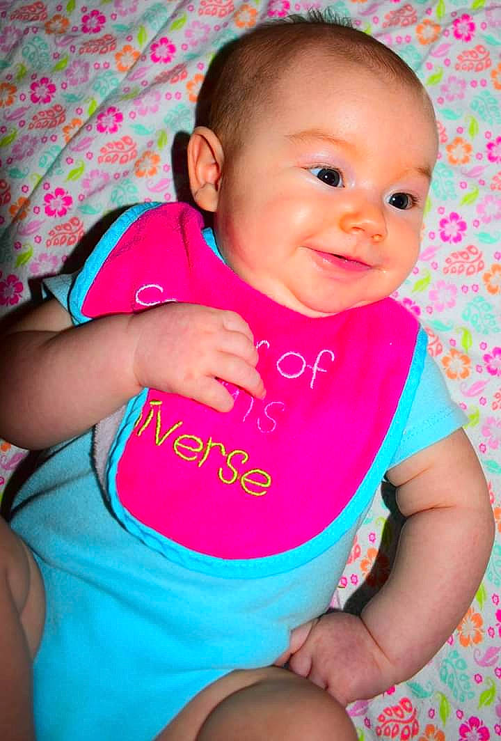 Stormy is registered to the contest to win money with this photo: baby, baby_products, baby_toddler_clothing, cheek, child, lip, magenta, person, pink, product, skin, toddler