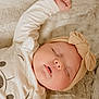 Elodie is registered to the contest to win money with this photo: baby, sleeping, headband, bow, blanket, soft_texture, infant, peaceful, closeup, face, skin, cute, adorable, child, rest, nap, cozy, clothing, young, portrait