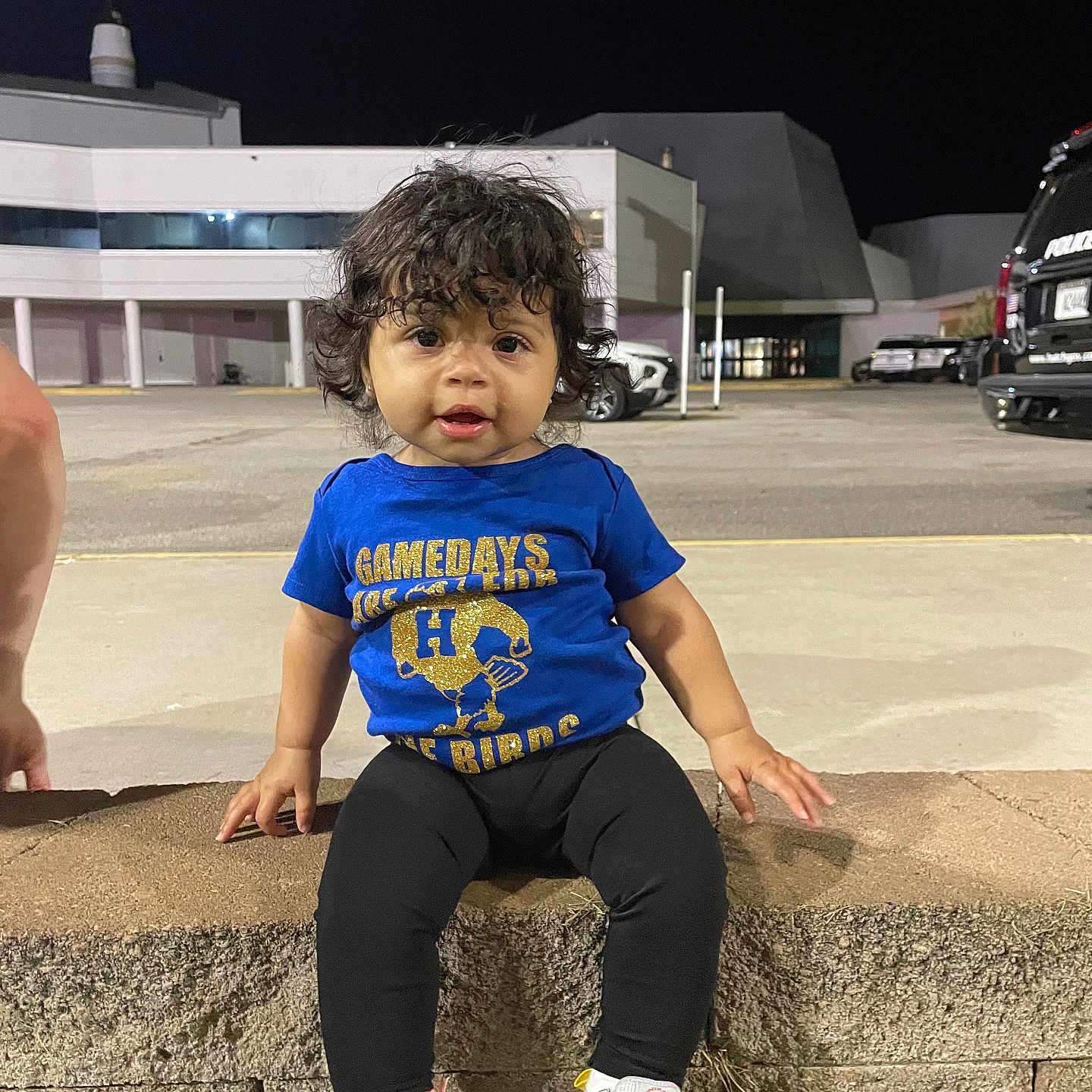 Kehlani joined the competition — help win amazing prizes! blue_tshirt, building, casual_clothing, child, curious, curly_hair, cute, expression, leggings, night, outdoor, parking_lot, person, sidewalk, sitting, small_child, sneakers, stone_ledge, toddler, urban