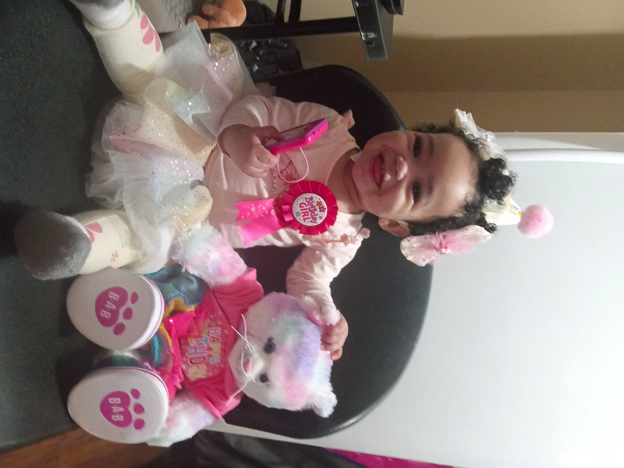 Halo is registered to the contest to win money with this photo: baby, baby_toddler_clothing, child, comfort_food, event, fun, happy, joy, person, pink, room, smile, toddler, white