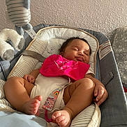 Cyenna joined the competition — help win amazing prizes! baby, sleeping, infant, bib, baby_carrier, plush_toy, foot, hand, striped_fabric, wall, indoor, relaxation, cute, peaceful, child, soft_lighting, comfort, pink, white, gray