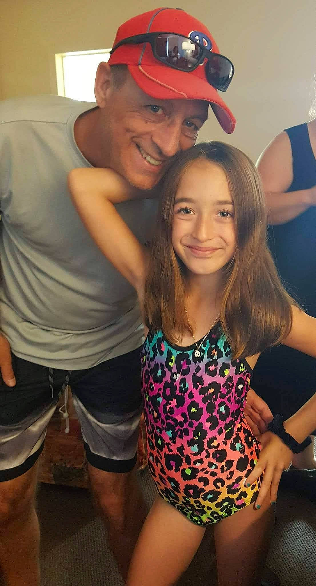 Madison is registered to the contest to win money with this photo: baseball_cap, cap, clothing, cool, fashion, fun, gesture, hairstyle, happy, hat, headwear, human, joy, leisure, mammal, muscle, organ, person, photograph, shorts