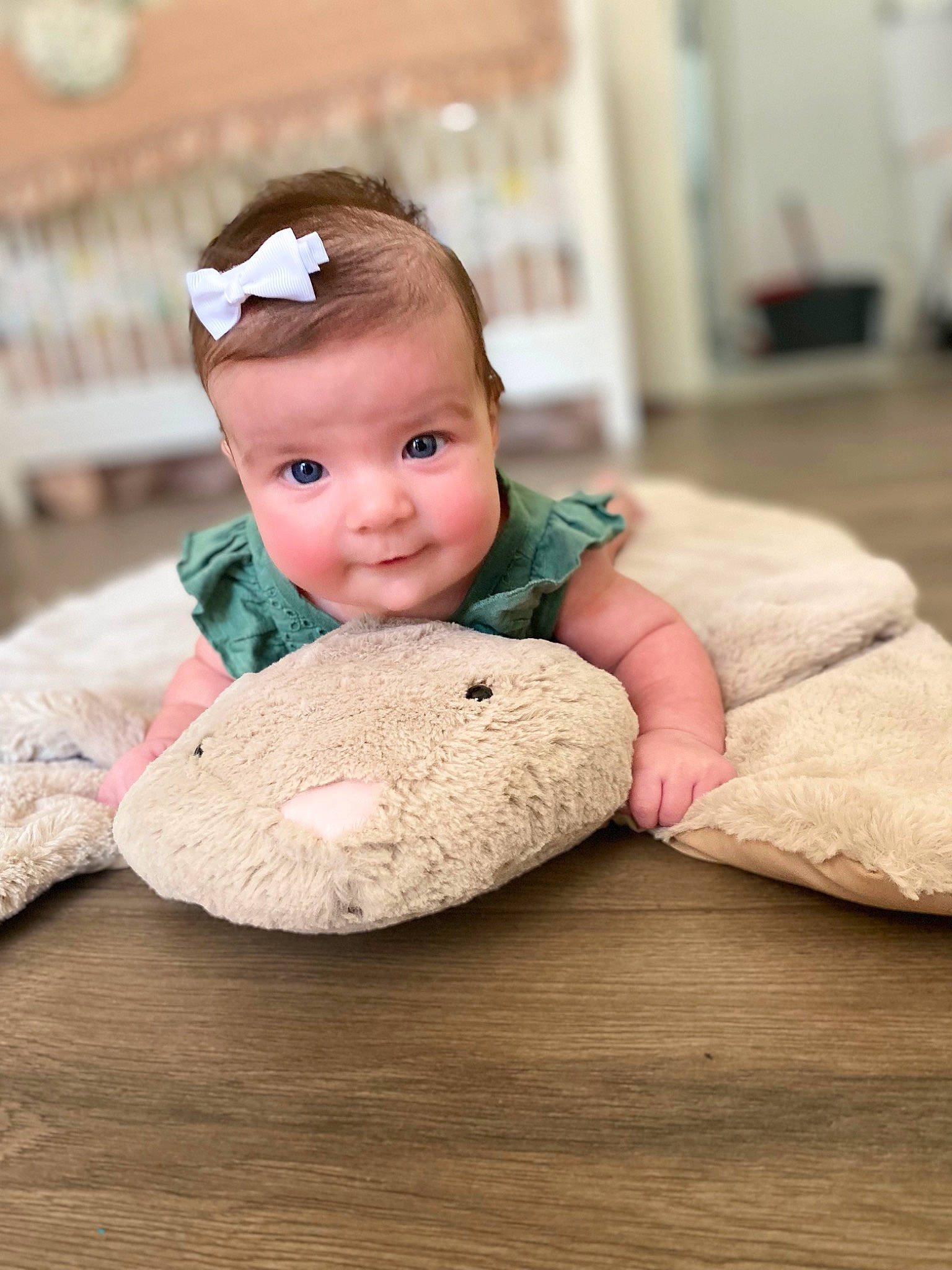 Madelynn is registered to the contest to win money with this photo: baby, baby_toddler_clothing, cap, cheek, chin, comfort, doll, finger, flooring, happy, headgear, mammal, nose, person, product, skin, stuffed_toy, textile, toddler, toy