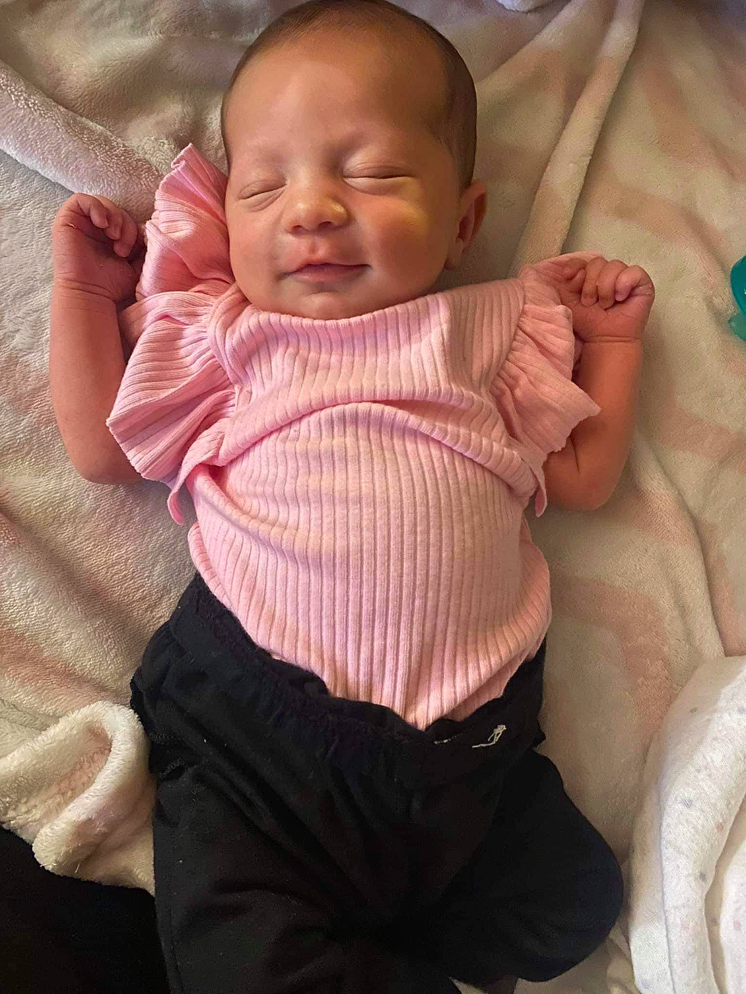 Briella is registered to the contest to win money with this photo: baby, baby_products, baby_toddler_clothing, cheek, child, chin, comfort, eye, linens, lip, mouth, neck, nose, person, pink, sitting, skin, sleeve, smile, thumb