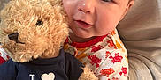 Mateo is registered to the contest to win money with this photo: baby, ball, couch, cushion, face, football, furniture, happy, head, homedecor, person, photography, plush, portrait, smile, soccer, soccerball, sport, teddybear, toy