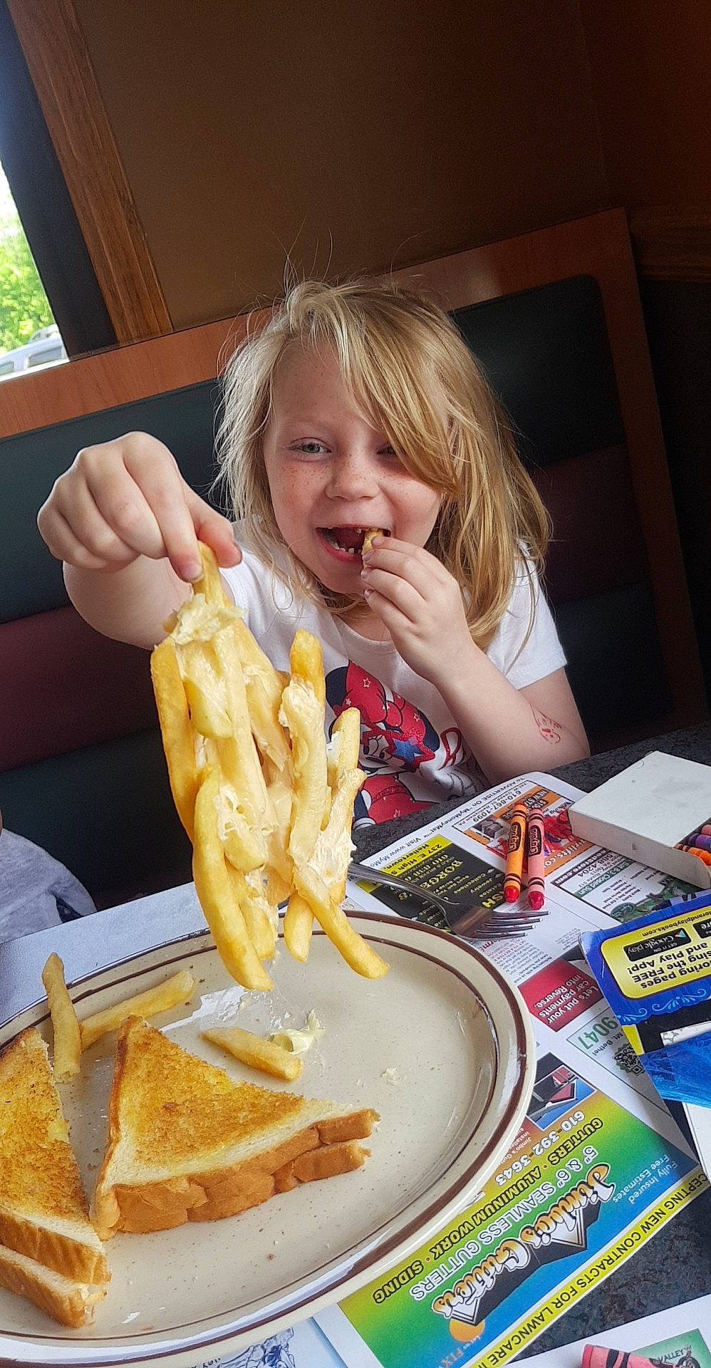 Aubry is registered to the contest to win money with this photo: baked_goods, blond, breakfast, comfort_food, cuisine, deep_frying, dish, eating, finger, food, french_fries, fried_food, junk_food, meal, person, plate, side_dish, snack, staple_food, tableware