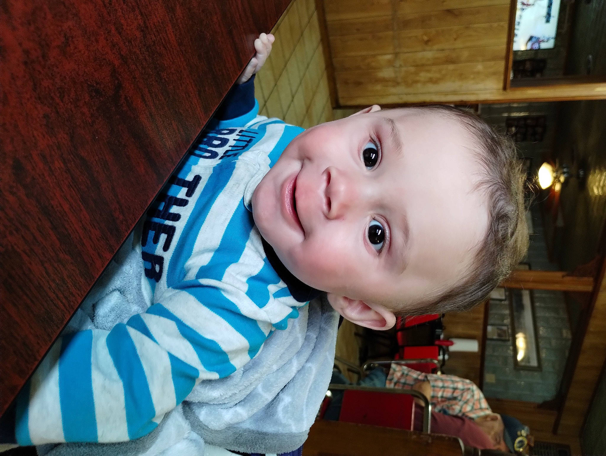 Lawson is registered to the contest to win money with this photo: baby, baby_toddler_clothing, cheek, child, chin, electric_blue, eye, fun, happy, hardwood, head, headwear, iris, joy, nose, person, room, sitting, skin, sleeve