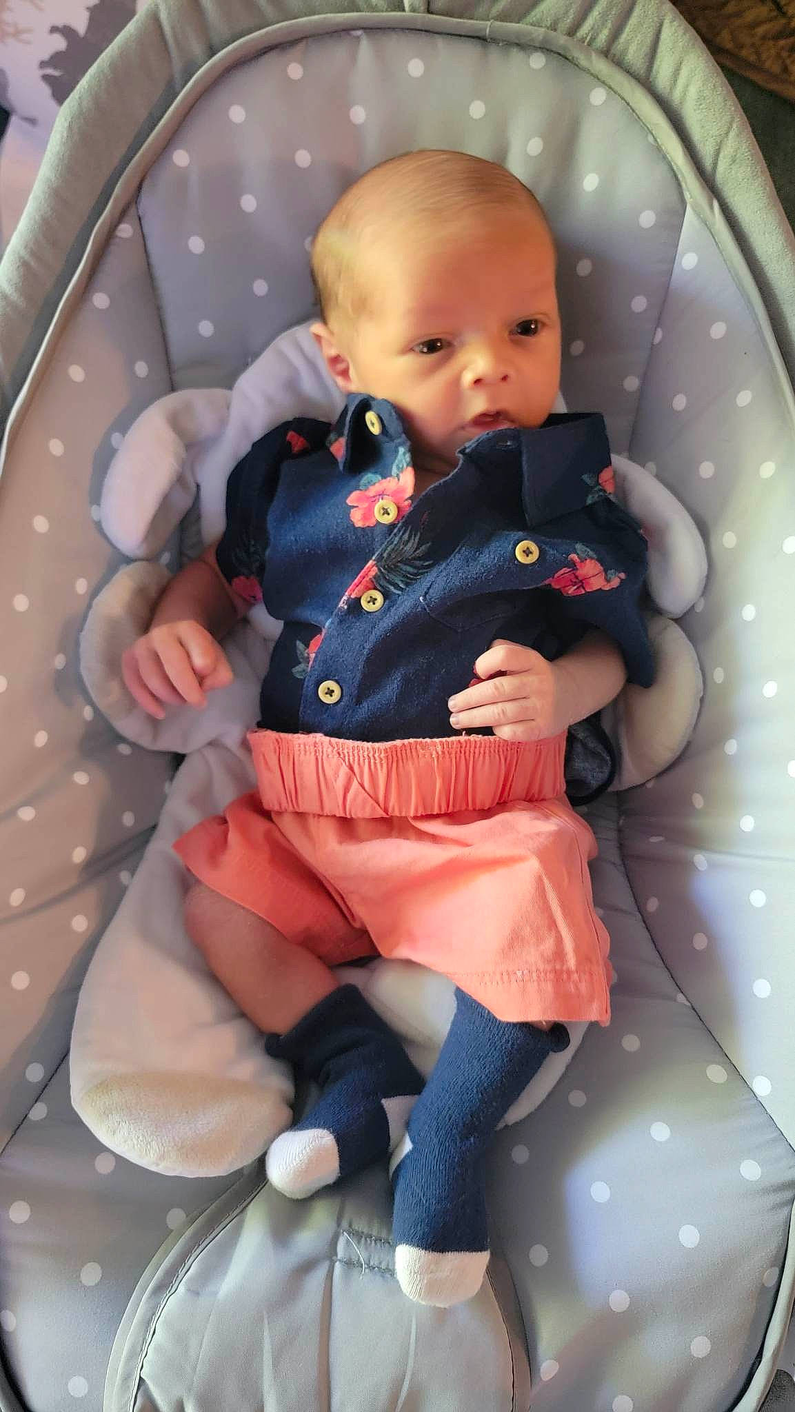 Liam joined the competition — help win amazing prizes! baby, baby_products, baby_toddler_clothing, car_seat, cheek, child, comfort, fun, head, lap, pattern, person, pink, product, room, sitting, skin, sleeve, sock, thigh