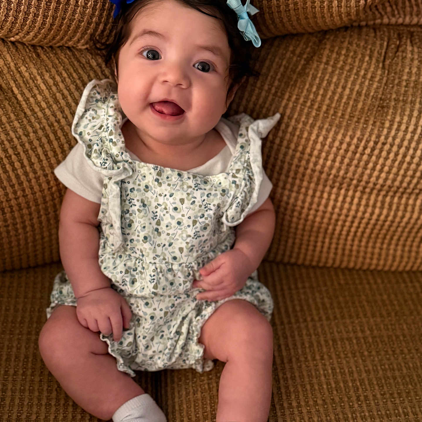 Olivia is registered to the contest to win money with this photo: architecture, baby, chair, clothing, couch, cushion, dress, face, furniture, happy, head, homedecor, hosiery, person, photography, portrait, shorts, sitting, smile, sock