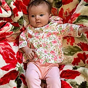 Shelbi joined the competition — help win amazing prizes! baby, infant, child, headband, tiara, floral_blanket, blanket, floral_top, pink_pants, newborn, portrait, lying_down, cute, eyes_open, hand, legs, skin, cozy, pattern, indoor