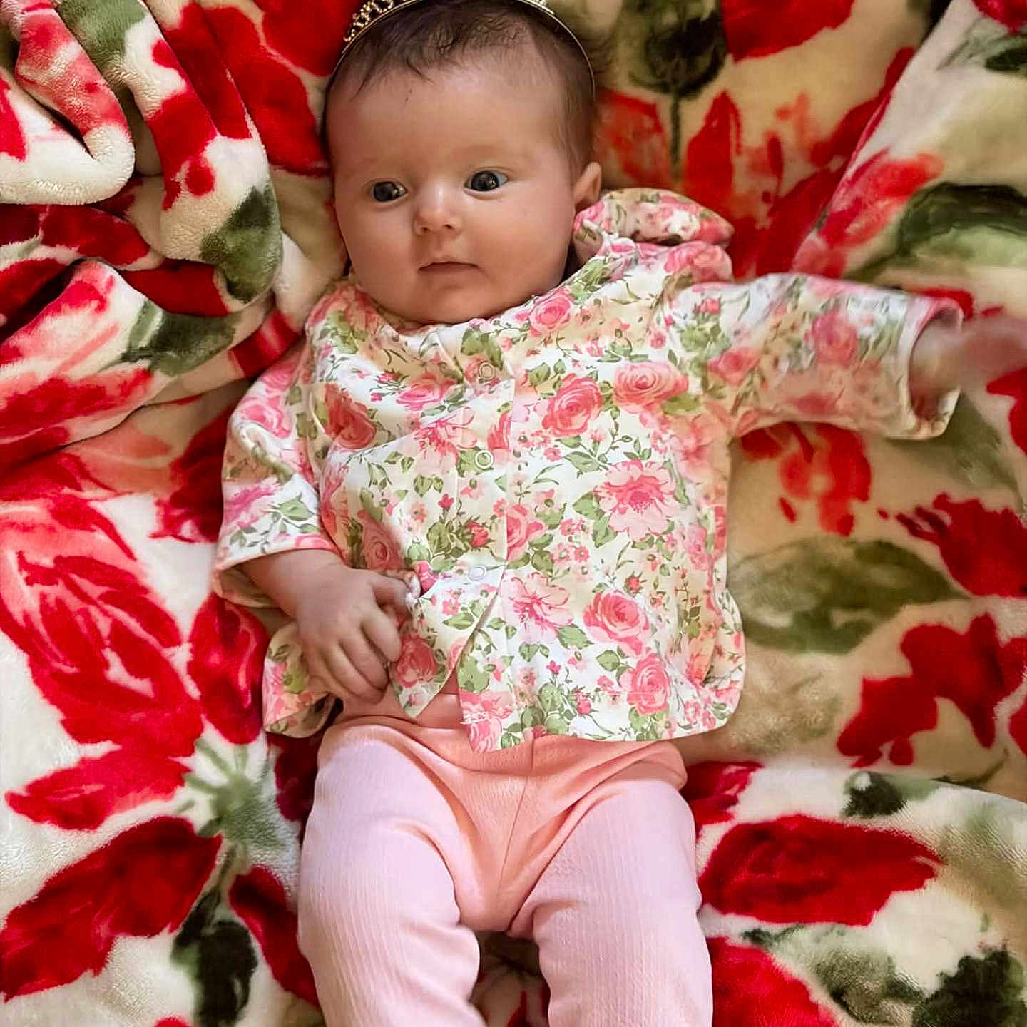 Shelbi joined the competition — help win amazing prizes! baby, blanket, child, cozy, cute, eyes_open, floral_blanket, floral_top, hand, headband, indoor, infant, legs, lying_down, newborn, pattern, pink_pants, portrait, skin, tiara