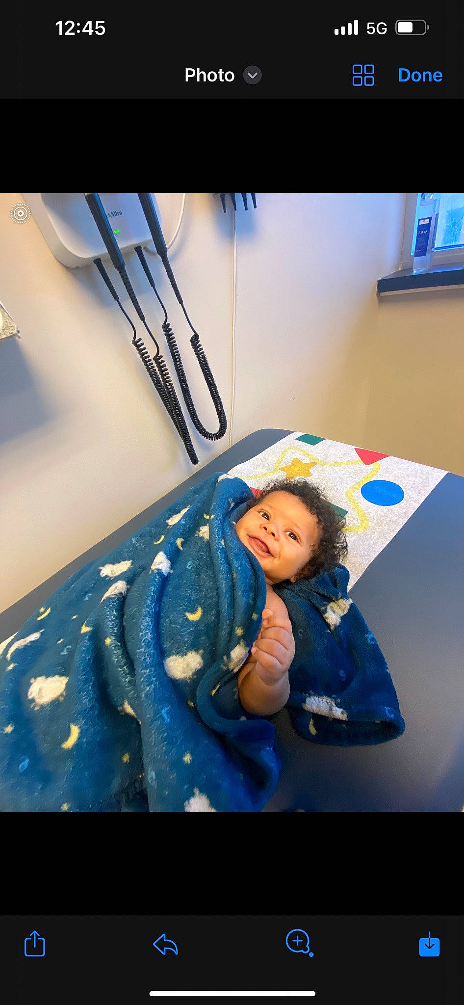 Amir is registered to the contest to win money with this photo: azure, baby, bed, bedding, blue, child, comfort, electric_blue, flooring, fun, happy, hat, hoodie, linens, person, picture_frame, room, sitting, t_shirt, toddler