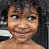 Syeir joined the competition — help win amazing prizes! child, curly_hair, smile, face, skin, portrait, closeup, happy, indoors, expression, person, cute, young, water_drops, natural_light, eyelashes, nostrils, mouth, shoulders, playful