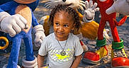 Syeir is registered to the contest to win money with this photo: child, boy, sonic, tails, knuckles, dr_robotnik, cartoon_characters, costume, outdoor, sunlight, street, holding_object, shoes, shorts, tshirt, happy, smile, posing, fantasy, colorful