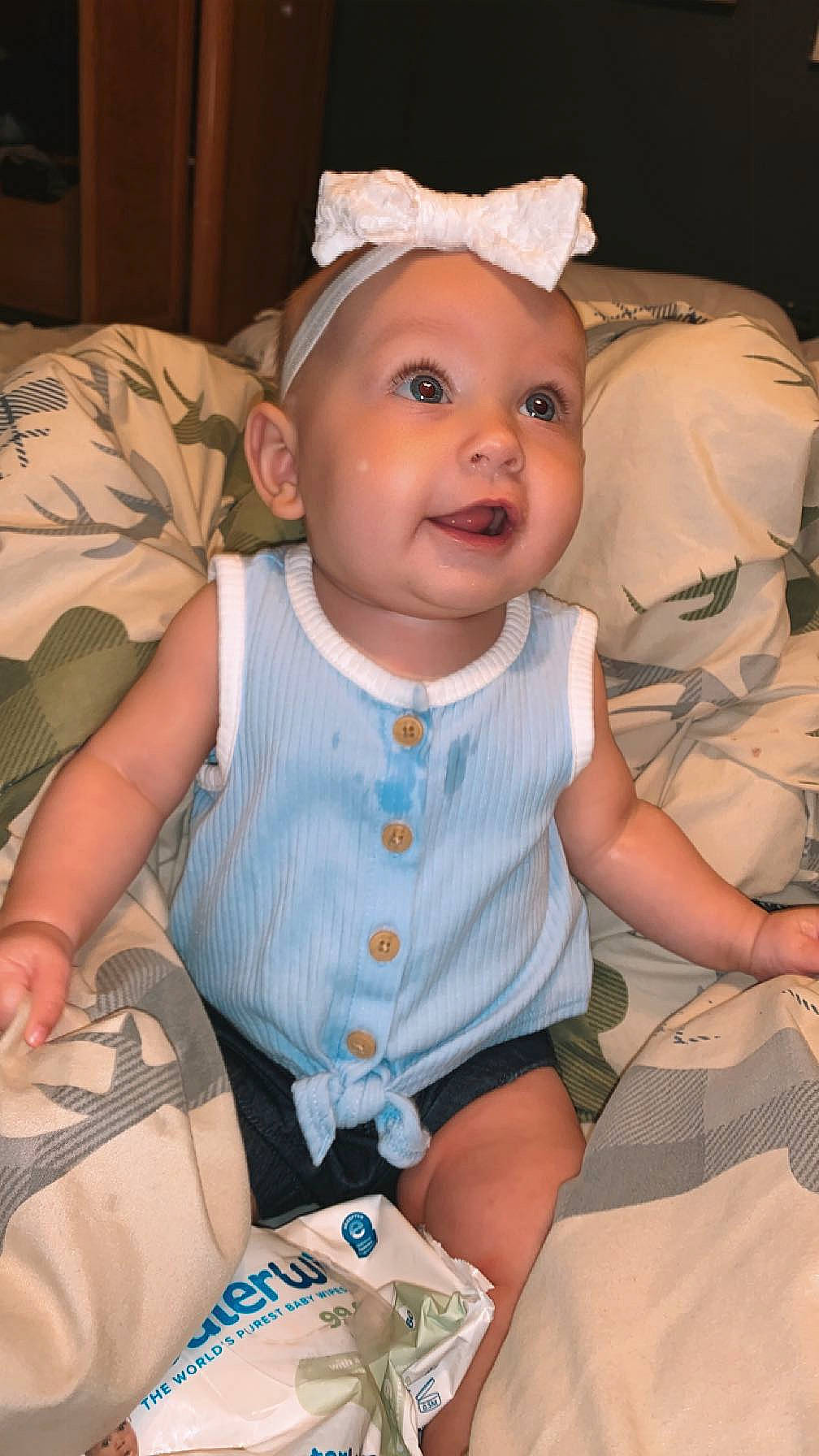 Kyla is registered to the contest to win money with this photo: baby, baby_toddler_clothing, cheek, chin, dress, eye, face, facial_expression, finger, head, human_body, iris, lip, mouth, nose, person, product, skin, sleeve, textile