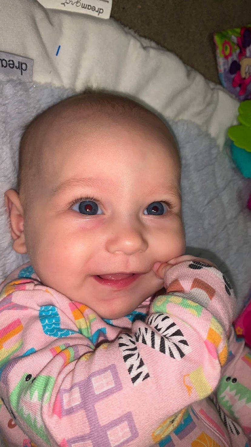 Kyla is registered to the contest to win money with this photo: baby, baby_toddler_clothing, cheek, chin, ear, eye, eyebrow, eyelash, forehead, green, head, iris, joy, lip, mouth, nose, organ, person, skin, smile