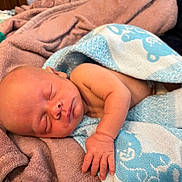 Azekiel joined the competition — help win amazing prizes! baby, blanket, blue, cozy, cute, face, hand, indoors, infant, newborn, pacifier, pattern, peaceful, pink, resting, sleeping, soft, towel, white, wrapped
