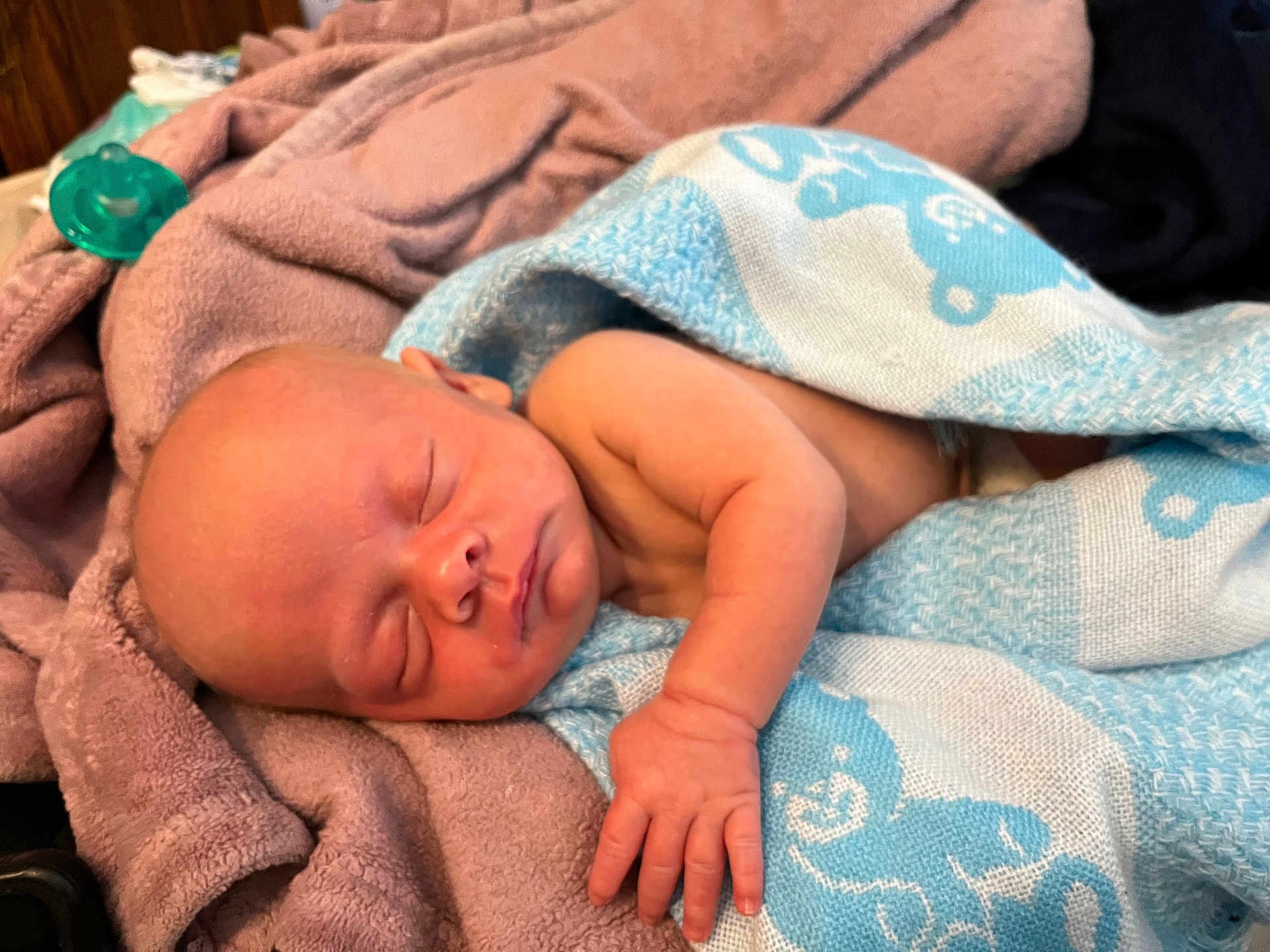 Azekiel joined the competition — help win amazing prizes! baby, blanket, blue, cozy, cute, face, hand, indoors, infant, newborn, pacifier, pattern, peaceful, pink, resting, sleeping, soft, towel, white, wrapped