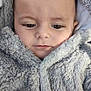baby, blanket, bonnet, cap, clothing, coat, face, fur, happy, hat, head, hood, hoodie, jacket, knitwear, person, photography, portrait, sweater, sweatshirt