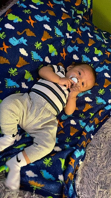 Antonio joined the competition — help win amazing prizes! baby, baby_toddler_clothing, child, comfort, flooring, fun, happy, leisure, linens, pattern, person, sitting, sleeve, toddler, wood