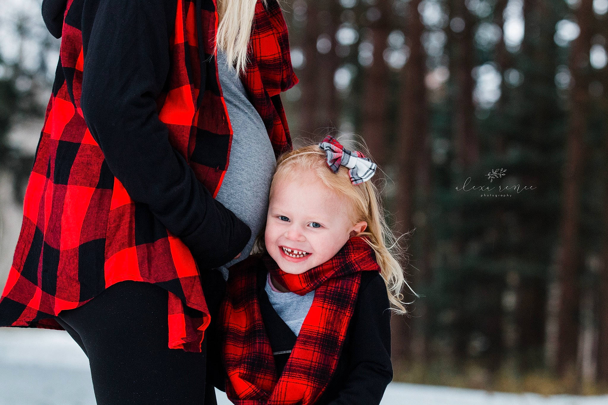 Kierra is registered to the contest to win money with this photo: baby, child, design, family, joy, pattern, people, person, photograph, photography, plaid, plant, portrait_photography, red, skin, smile, snow, tartan, textile, toddler
