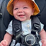 baby, smiling, hat, car_seat, safety_harness, child, cute, happy, infant, closeup, portrait, clothing, seatbelt, baby_clothes, face, person, young_child, safety, headwear, baby_boy