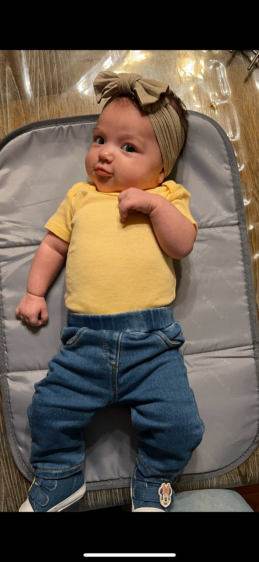 Lenaya participe au concours pour gagner de l'argent avec cette photo : baby, bodypart, cap, clothing, couch, cushion, face, finger, footwear, furniture, hand, hat, head, homedecor, jeans, pants, person, photography, portrait, shoe