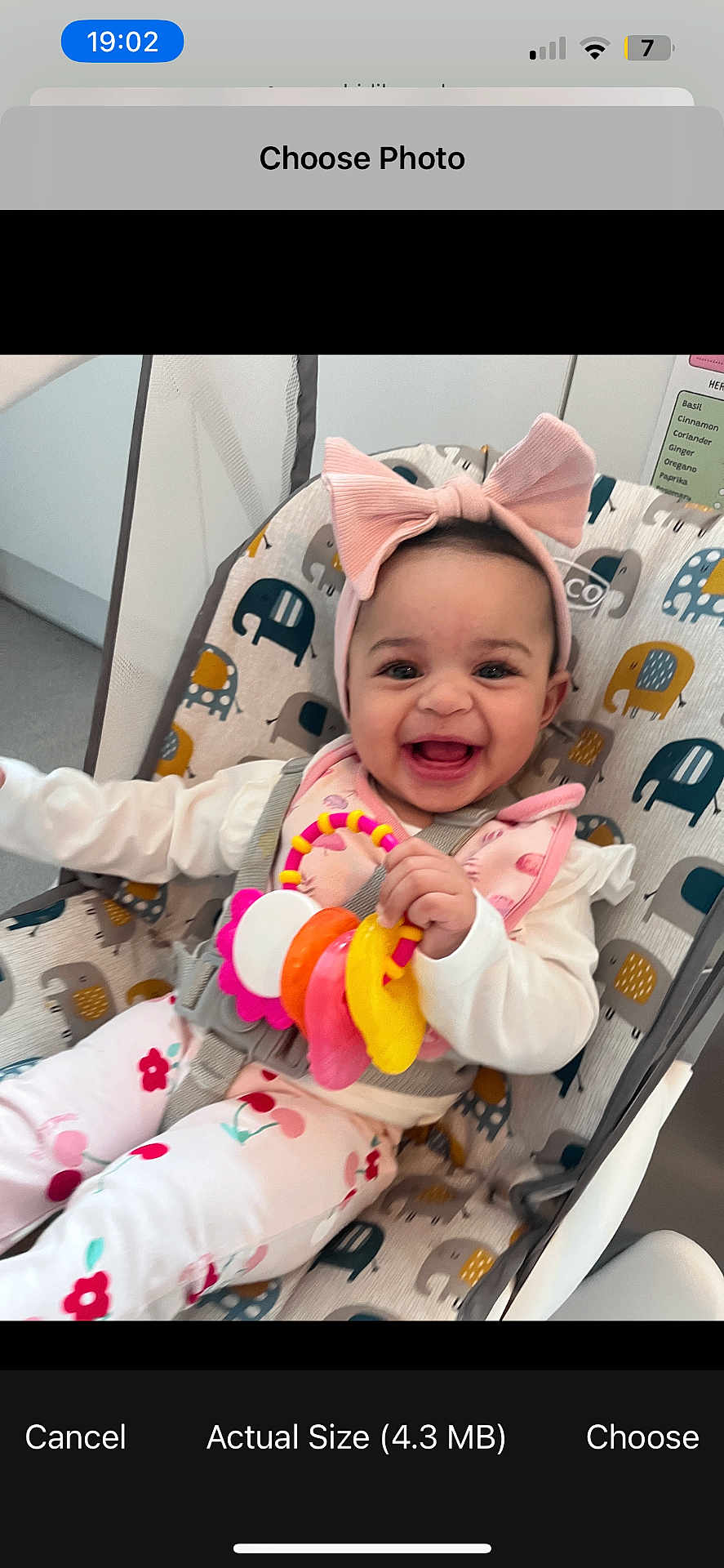 Nova joined the competition — help win amazing prizes! baby, child, smiling, headband, pink_bow, toy, baby_chair, elephant_pattern, happy, indoor, clothing, white_shirt, floral_pants, infant, cute, playful, seated, colorful, portrait, young_child