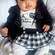 Kaly a rejoint le concours — aidez-le/la à gagner de superbes lots ! baby, child, infant, face, clothing, jacket, skirt, white, black, blanket, legs, hands, cute, portrait, indoor, soft, socks, ribbons, buttons, eyes