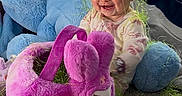 Haizley is registered to the contest to win money with this photo: baby, blue, carpet, child, clothing, colorful, cute, floor, green_grass, happy, indoors, person, playtime, plush_bunny, purple, rubber_duck, smiling, stuffed_animal, toys, yellow