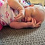 Haizley is registered to the contest to win money with this photo: baby, newborn, sleeping, infant, carpet, clothing, pink_pants, face, hand, peaceful, resting, cute, skin, closeup, indoor, person, portrait, soft, tiny, nap