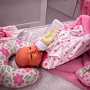 Haizley joined the competition — help win amazing prizes! baby, infant, bottle, feeding, pajamas, pink, blanket, pillow, polka_dot, sleeping_bed, crib, face, newborn, cute, indoors, child, milk, soft, resting, lying_down