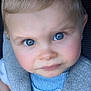 child, toddler, face, blue_eyes, curious, close_up, striped_shirt, seatbelt, car_seat, soft_lighting, blond_hair, innocent, baby, portrait, person, clothing, young_child, cute, skin, eyelashes