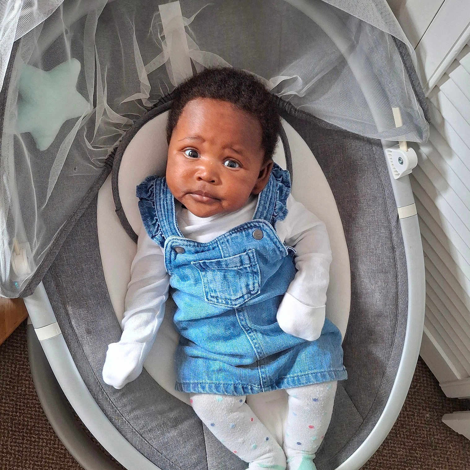 Akeno joined the competition — help win amazing prizes! baby, baby_rocker, carpet, child, childrens_fashion, comfort, curious, cute, denim_dress, expression, face, furniture, indoor, infant, modern, person, polka_dots, portrait, tights, white_shirt