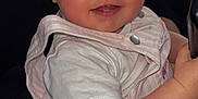 Ylona participe au concours pour gagner de l'argent avec cette photo : baby, child, face, smile, eyes, red_eye, clothing, striped, sitting, cute, indoor, person, infant, short_sleeve, pink, white, cheek, hand, portrait, young