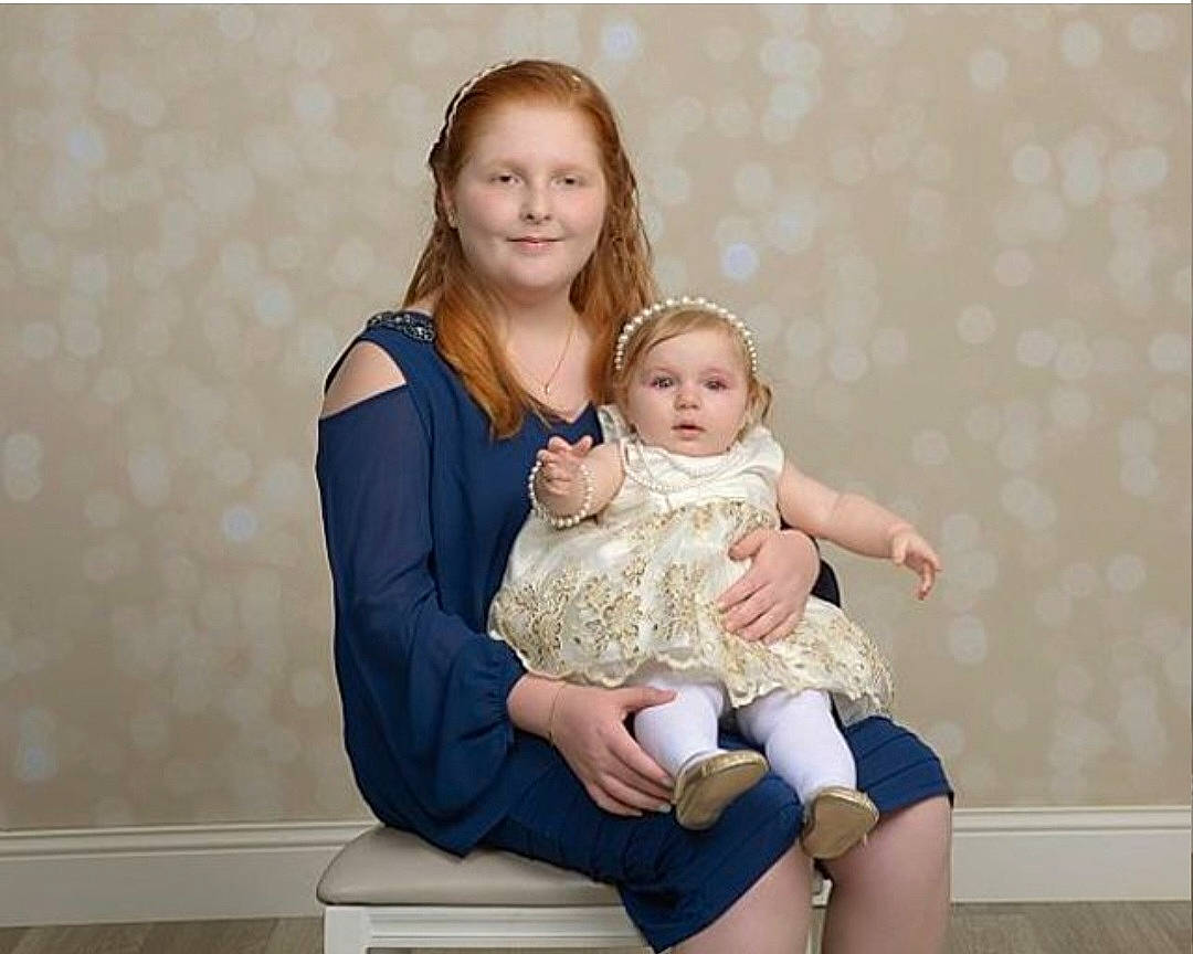 Lauren joined the competition — help win amazing prizes! arm, baby, baby_toddler_clothing, comfort, couch, event, face, flash_photography, fun, gesture, happy, joy, knee, leg, leisure, person, sitting, sleeve, smile, t_shirt