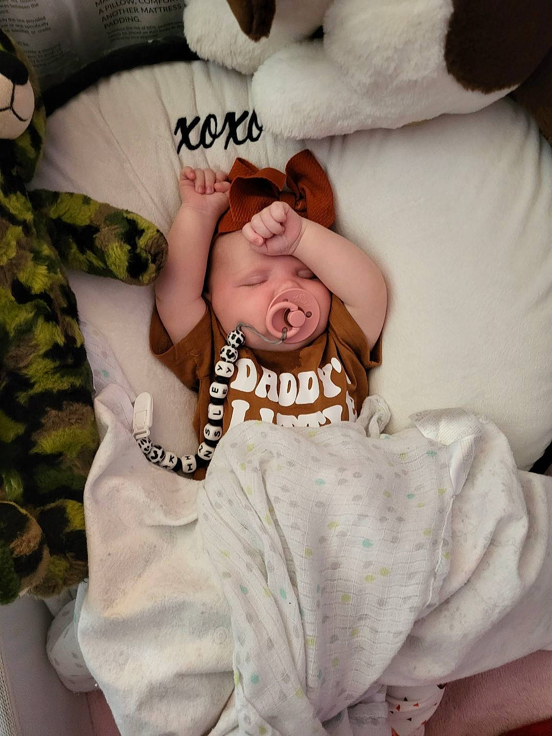 Kinsley joined the competition — help win amazing prizes! baby, baby_sleeping, baby_toddler_clothing, camouflage, child, comfort, facial_expression, finger, font, fur, gesture, happy, head, linens, military_camouflage, neck, person, sleeve, textile, toddler