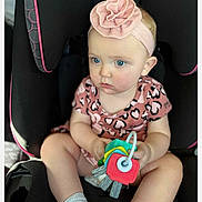 Kinsley joined the competition — help win amazing prizes! baby, child, car_seat, pink_headband, toy, blue_eyes, leopard_print, clothing, infant, sitting, cute, girl, portrait, indoor, seat, accessory, headwear, holding, person, young