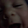 Parker joined the competition — help win amazing prizes! child, face, closeup, blurry, dark, expression, mouth, nose, eye, skin, portrait, person, indoor, unfocused, young, head, emotion, smile, happy, baby