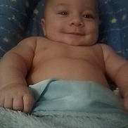 Parker is registered to the contest to win money with this photo: arms, baby, baby_photography, bare_chest, bedtime, blanket, blue_blanket, child, close_up, cozy, diaper, face, hands, happy, indoor, infant, lying_down, portrait, smiling, soft_fabric