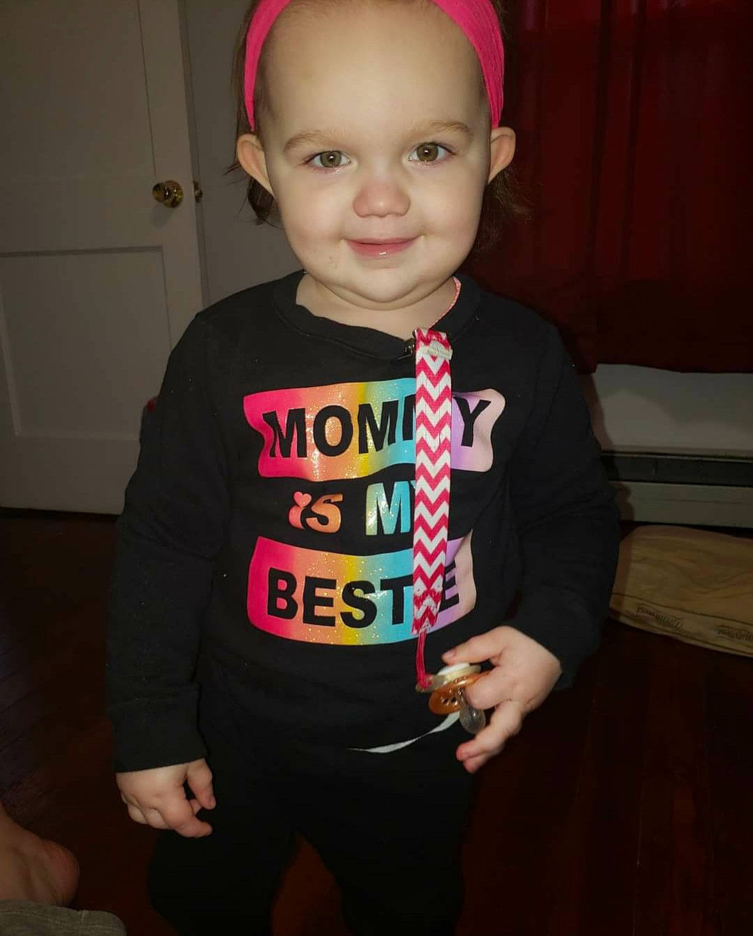 Lillian Aka Lilly is registered to the contest to win money with this photo: cheek, child, ear, face, head, joy, outerwear, person, pink, skin, smile, t_shirt, toddler, tooth